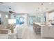 Open-concept living space seamlessly connecting the living room, kitchen, and dining area at 13871 Miranese St, Venice, FL 34293