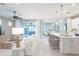 Bright living area with an open floor plan that flows into the kitchen and dining area at 13871 Miranese St, Venice, FL 34293