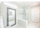 Modern bathroom showcasing glass shower with tile accents, and large mirror reflecting double vanity at 13871 Miranese St, Venice, FL 34293