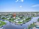 Waterfront property aerial showcasing community, waterways, and access to recreational activities at 16 Oakwood N Dr # 16, Englewood, FL 34223
