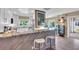 Stylish kitchen featuring a stone countertop bar with seating, complemented by modern cabinetry and stainless steel appliances at 16 Oakwood N Dr # 16, Englewood, FL 34223