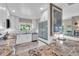 Bright kitchen with white cabinets, stainless steel appliances, granite countertops, and a functional breakfast bar at 16 Oakwood N Dr # 16, Englewood, FL 34223
