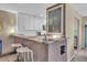 Well-designed kitchen boasting stone countertops, a functional breakfast bar, and a convenient wine rack for entertaining at 16 Oakwood N Dr # 16, Englewood, FL 34223