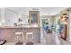 Spacious kitchen and dining area with bar seating, stainless appliances, and ample natural light for a welcoming atmosphere at 16 Oakwood N Dr # 16, Englewood, FL 34223