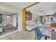Open-concept living area with neutral color scheme, access to outdoor spaces, and ample room for furnishings at 16 Oakwood N Dr # 16, Englewood, FL 34223