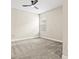 Neutral bedroom featuring a ceiling fan, window, and plush gray carpeting at 1607 Laurel Brook Ln, Port Charlotte, FL 33953