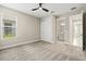 Bedroom with a ceiling fan, closet, and an ensuite bathroom at 1607 Laurel Brook Ln, Port Charlotte, FL 33953
