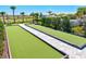 Enjoy outdoor recreation with beautiful bocce ball courts nestled within lush landscaping, ideal for community enjoyment at 1607 Laurel Brook Ln, Port Charlotte, FL 33953