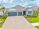 Charming home with a 2-car garage, landscaped front yard, and inviting curb appeal at 1607 Laurel Brook Ln, Port Charlotte, FL 33953