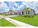 Beautiful view of the well-manicured lawn, with sidewalks, in a neighborhood at 1607 Laurel Brook Ln, Port Charlotte, FL 33953