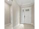 Inviting entryway featuring neutral walls, tile flooring, and a view into other rooms at 1607 Laurel Brook Ln, Port Charlotte, FL 33953
