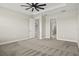 An interior view of the main bedroom highlighting the doorways to the closet and bathroom at 1607 Laurel Brook Ln, Port Charlotte, FL 33953