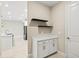 Convenient mudroom area with storage cabinets and floating shelves near the kitchen at 1607 Laurel Brook Ln, Port Charlotte, FL 33953