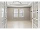 Office space with double doors and lots of natural light from two windows at 1607 Laurel Brook Ln, Port Charlotte, FL 33953