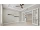 Office space with double doors, a ceiling fan, recessed lighting, and floating shelves at 1607 Laurel Brook Ln, Port Charlotte, FL 33953