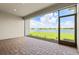 Screened patio overlooking a serene lake view with fountain, brick floor, and outdoor lighting at 1607 Laurel Brook Ln, Port Charlotte, FL 33953