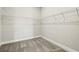 A carpeted walk-in closet with white wire shelving at 1607 Laurel Brook Ln, Port Charlotte, FL 33953