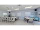Bright community room with ample seating, tables, and natural light, perfect for social gatherings at 168 The Corso # 168, Venice, FL 34285