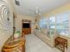 Inviting living room featuring a comfortable sofa, tile floors, and ample natural light at 168 The Corso # 168, Venice, FL 34285
