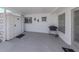 A covered patio with a grill and seating area perfect for outdoor enjoyment at 168 The Corso # 168, Venice, FL 34285