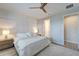 This is a well-lit bedroom with a decorative wall feature and wood-look flooring at 17873 Grand Prosperity Dr, Venice, FL 34293