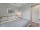 Inviting bedroom with modern decor, soothing colors, and plank flooring at 17873 Grand Prosperity Dr, Venice, FL 34293