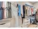 Walk-in closet featuring built-in shelving and ample storage for clothing and accessories at 17873 Grand Prosperity Dr, Venice, FL 34293