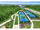 Well-maintained tennis and bocce ball courts nestled within lush landscaping, perfect for active recreation at 17873 Grand Prosperity Dr, Venice, FL 34293