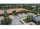 Stunning aerial view of a spacious townhome community with beautiful landscaping and serene water views at 19269 Serafina St, Venice, FL 34293