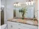 Bathroom with double sinks and granite countertops at 19269 Serafina St, Venice, FL 34293