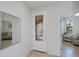 Inviting entryway featuring a decorative glass front door and a view into the adjacent rooms at 19269 Serafina St, Venice, FL 34293