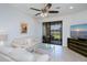 Cozy living room with sliding doors leading to patio and water view at 19269 Serafina St, Venice, FL 34293