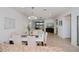 Bright open-concept living space with tile floors, modern lighting, and sliding doors to outdoor living area at 19269 Serafina St, Venice, FL 34293