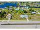 Wide aerial view of the neighborhood with canals and lush landscaping near the home at 20430 Edgewater Dr, Port Charlotte, FL 33952