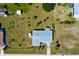 Birds eye view of a single-Gathering home with a well maintained lawn and mature landscaping at 20430 Edgewater Dr, Port Charlotte, FL 33952