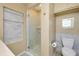 This bathroom features marble tile in shower and on walls, plus cabinet and drawers for storage at 20430 Edgewater Dr, Port Charlotte, FL 33952