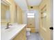 Bathroom with tile floors, single vanity, and a tub/shower combo with a shower curtain at 20430 Edgewater Dr, Port Charlotte, FL 33952