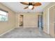 Bedroom featuring neutral walls, tile flooring, and a standard sized closet with louvered doors at 20430 Edgewater Dr, Port Charlotte, FL 33952