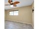 Spacious bedroom with a ceiling fan and neutral paint at 20430 Edgewater Dr, Port Charlotte, FL 33952