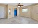 Bedroom featuring neutral walls, tile flooring, and a standard sized closet with louvered doors at 20430 Edgewater Dr, Port Charlotte, FL 33952