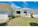 Charming single-story home with manicured lawn and shrubs at 20430 Edgewater Dr, Port Charlotte, FL 33952