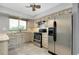 Updated kitchen with stainless steel appliances and ample counter space at 20430 Edgewater Dr, Port Charlotte, FL 33952