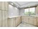 Well-lit kitchen with plenty of cabinet storage and granite countertops at 20430 Edgewater Dr, Port Charlotte, FL 33952