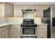 A kitchen featuring modern appliances, sleek countertops, and tile backsplash at 20430 Edgewater Dr, Port Charlotte, FL 33952