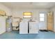 Functional laundry area with modern washer, dryer, utility sink, and water heater at 20430 Edgewater Dr, Port Charlotte, FL 33952