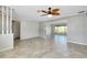 Bright and airy living room featuring tile flooring and a unique ceiling fan at 20430 Edgewater Dr, Port Charlotte, FL 33952