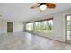 Bright living area with large windows and a cozy atmosphere, perfect for relaxing at 20430 Edgewater Dr, Port Charlotte, FL 33952
