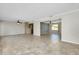 Expansive living room with tile flooring, ceiling fans, and an open layout at 20430 Edgewater Dr, Port Charlotte, FL 33952