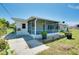 Enclosed screened lanai with a door to the backyard and ample space for relaxing at 20430 Edgewater Dr, Port Charlotte, FL 33952