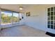 This screened porch offers tiled flooring and outdoor access at 20430 Edgewater Dr, Port Charlotte, FL 33952